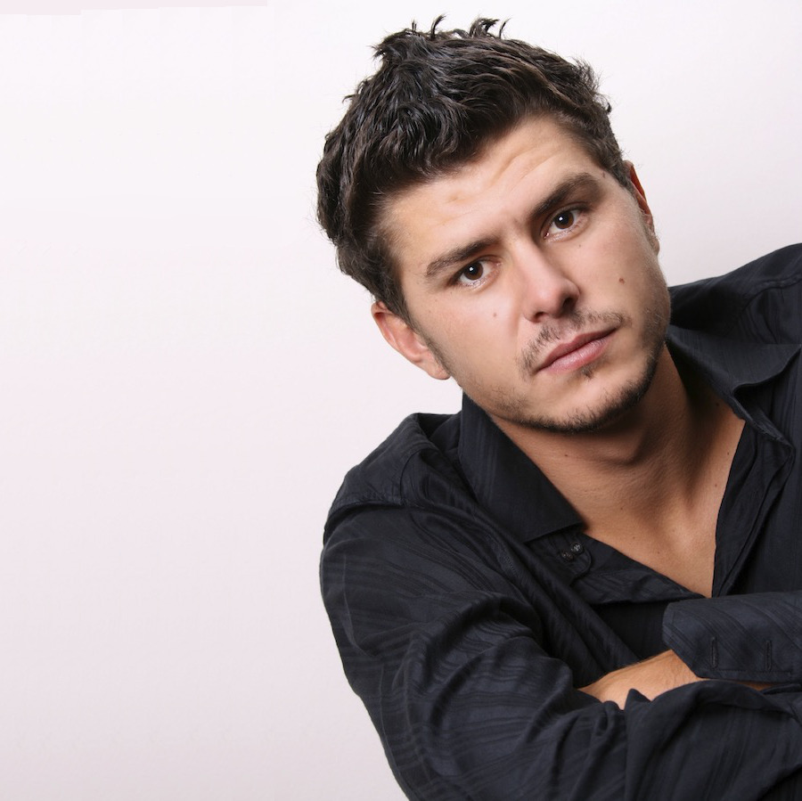 Male model in studio against white wall